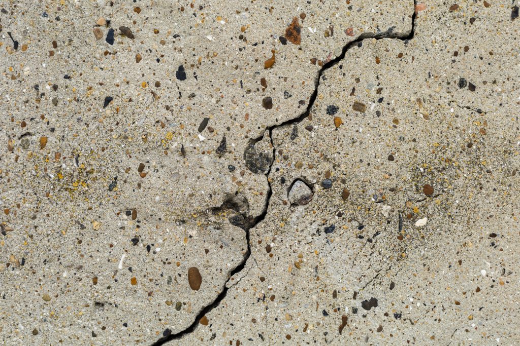 rough-textured-surface-of-a-cracked-concrete-found-2026-01-11-09-31-13-utc